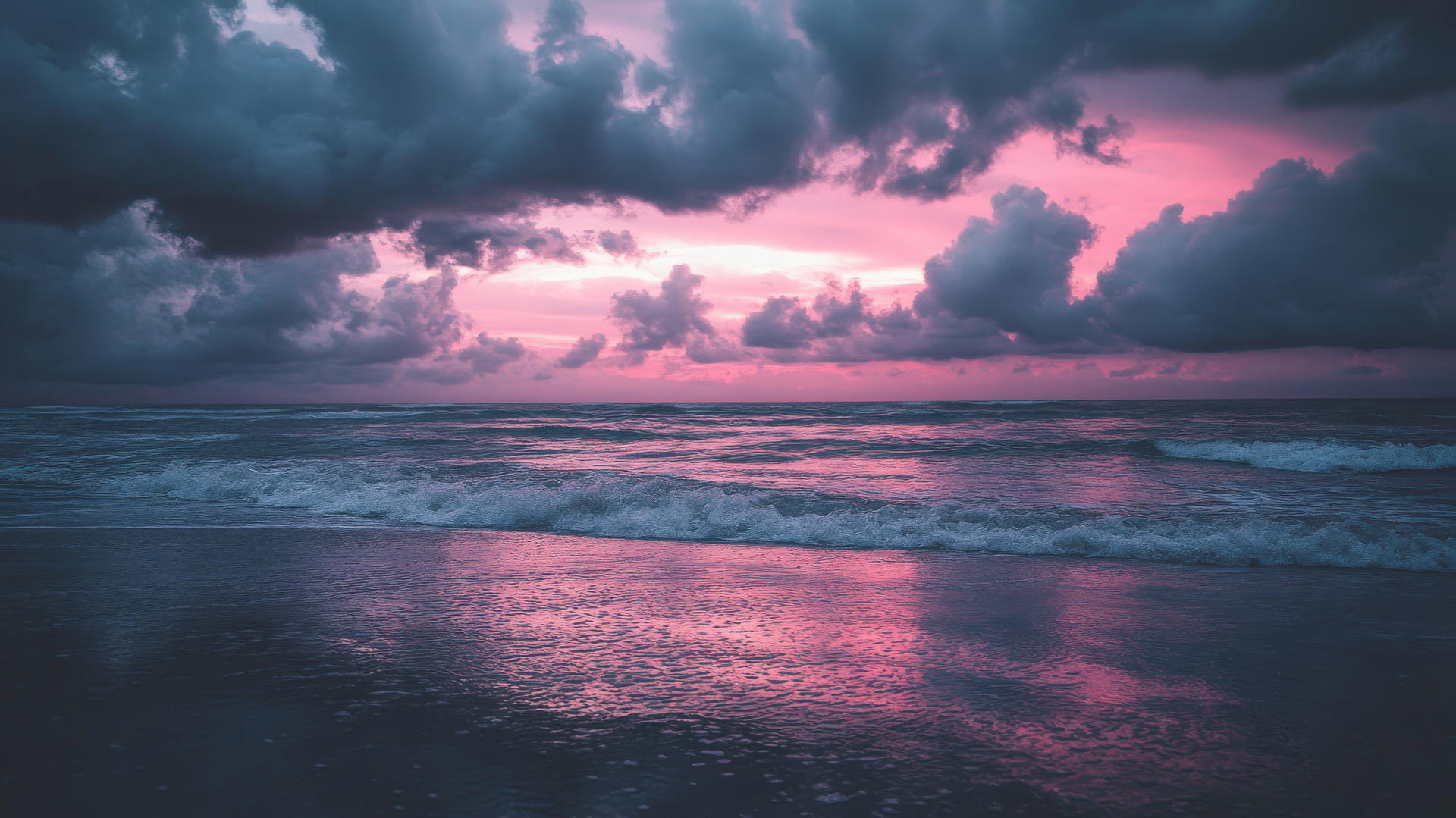 Beach aesthetic wallpaper with twilight, dark clouds, and soft pinks and purples.