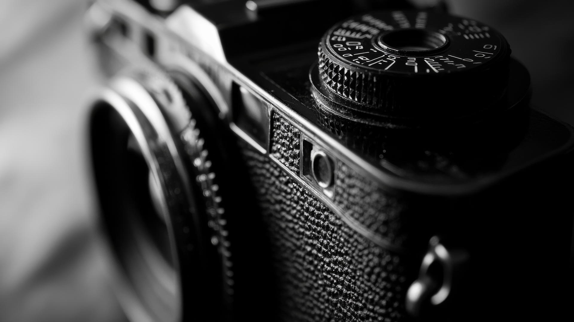 black and white aesthetic wallpaper featuring a vintage camera close-up