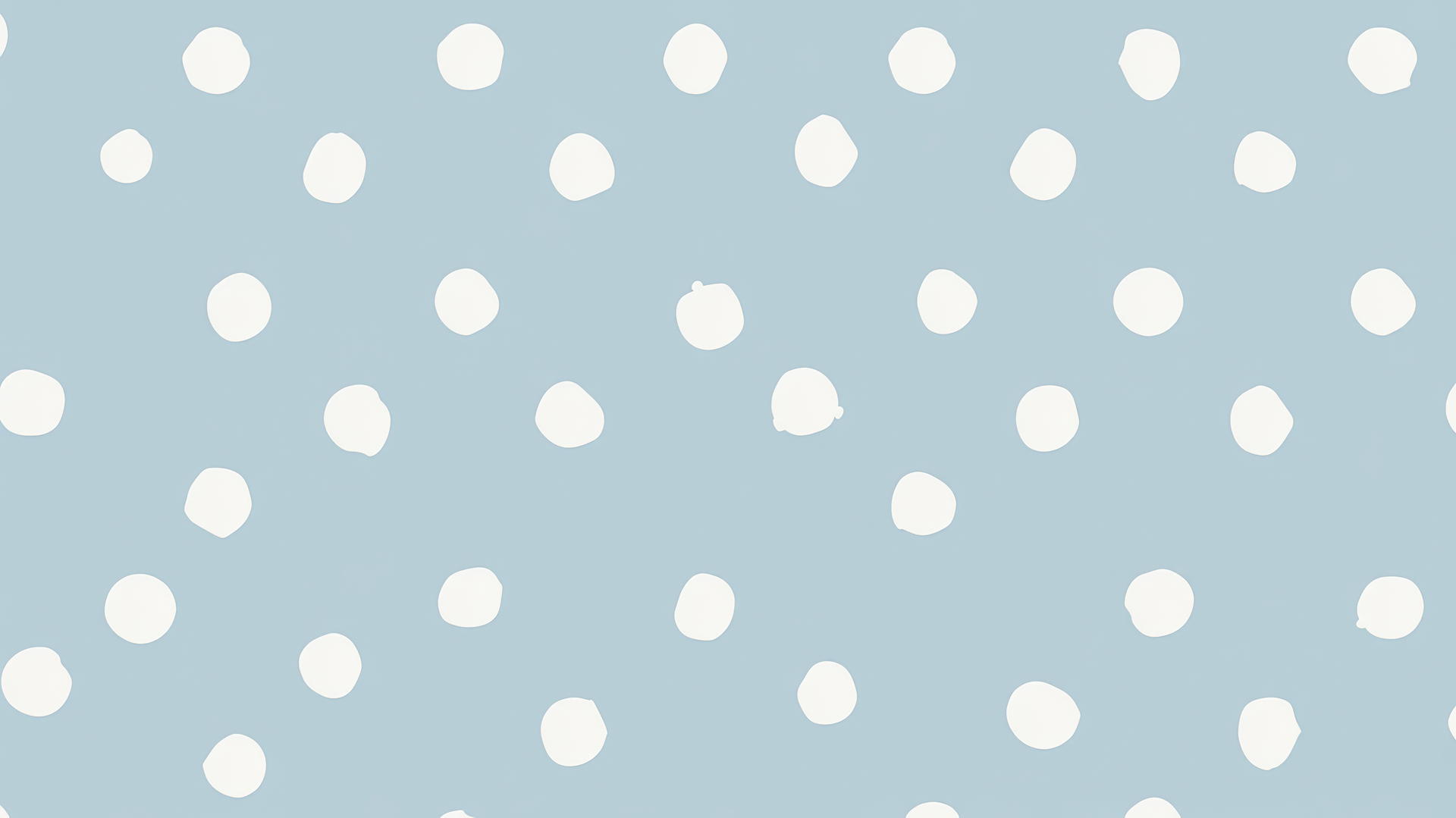 Light blue wallpaper with playful white polka dots