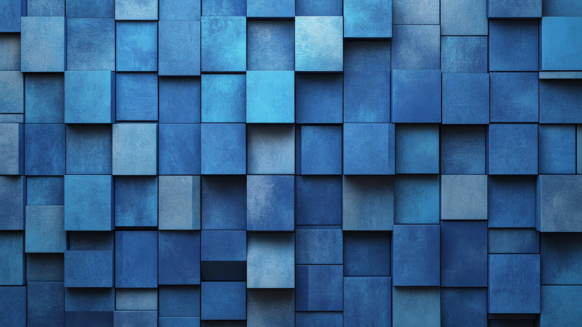 A mosaic of geometric tiles in shades of royal blue with silver accents