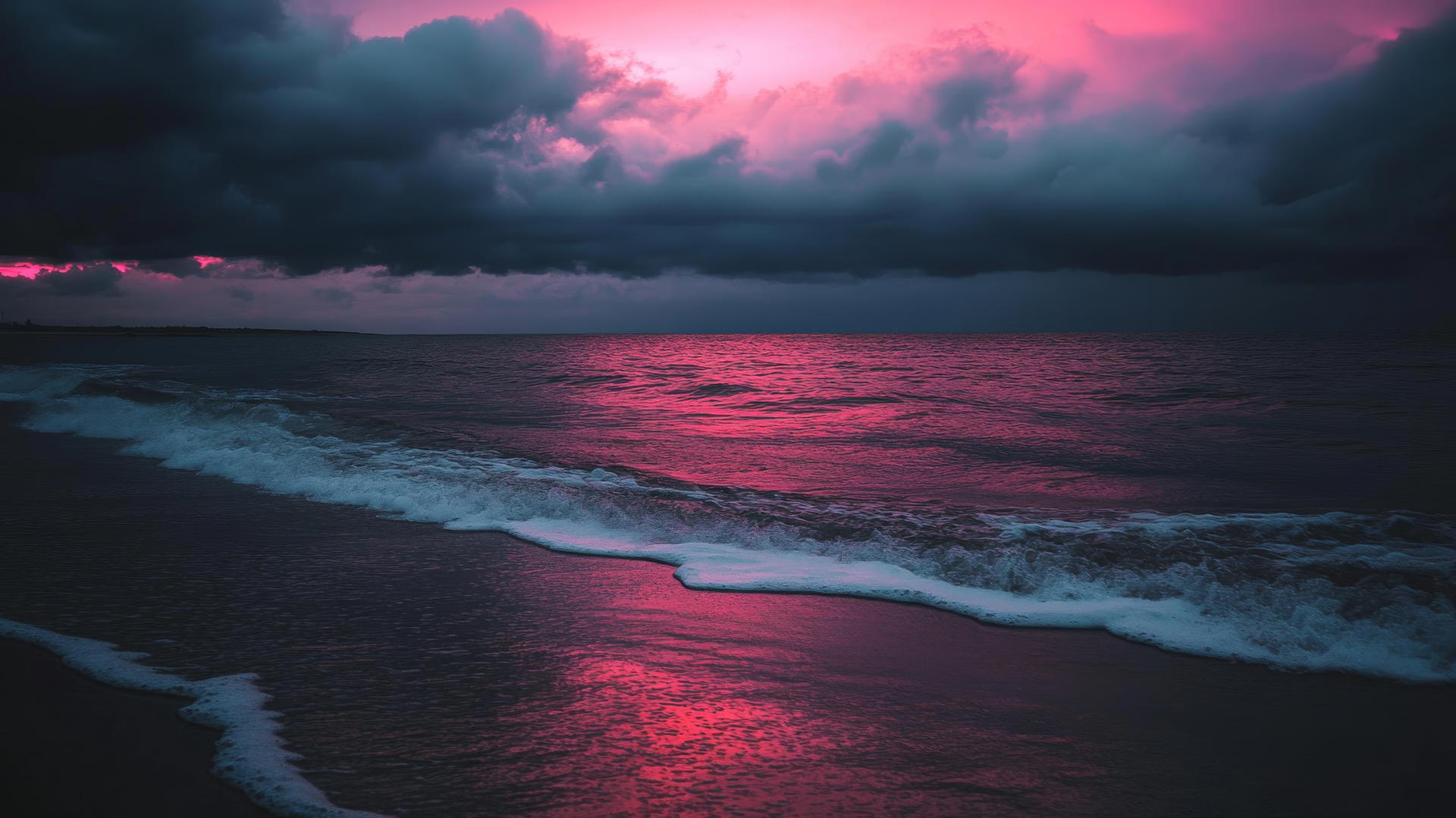 Beach aesthetic wallpaper at twilight with dark clouds, soft pinks and purples in the sky, and gentle waves.