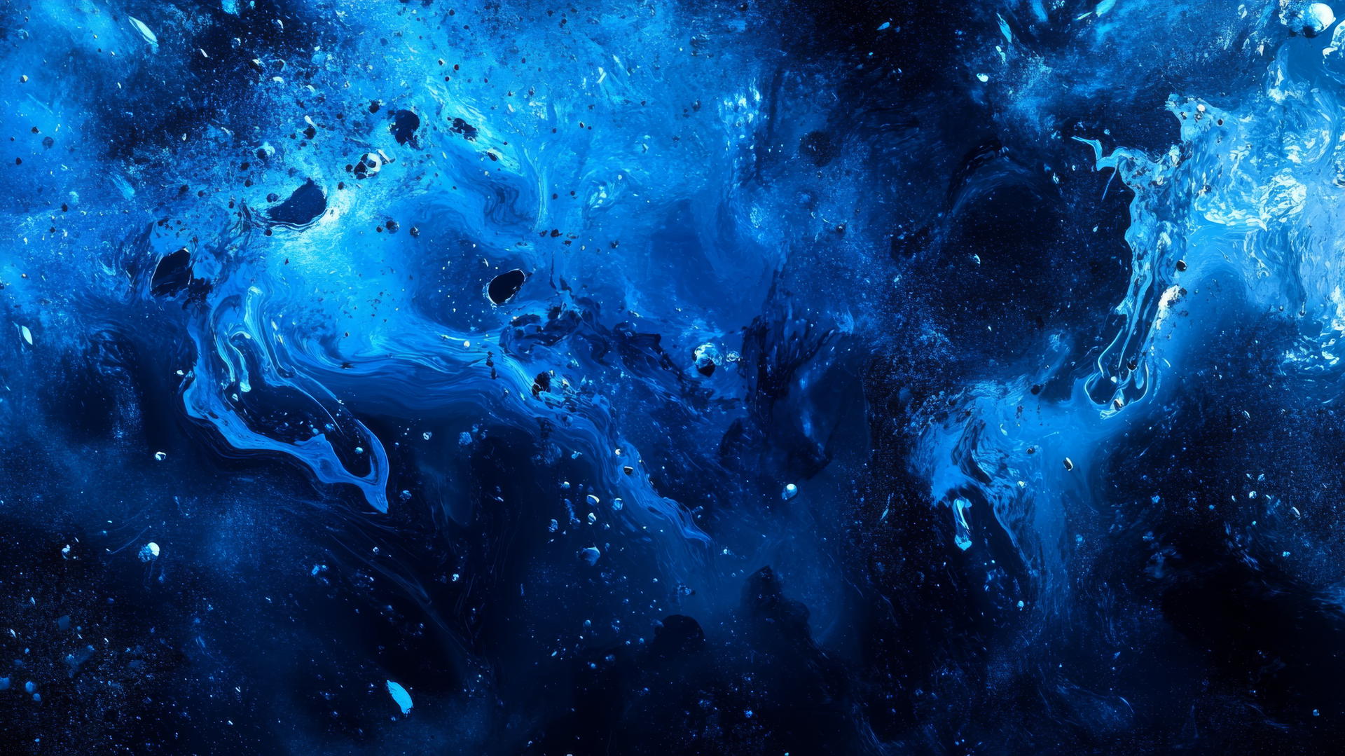 A dynamic blue wallpaper with abstract splashes of various blue tones.
