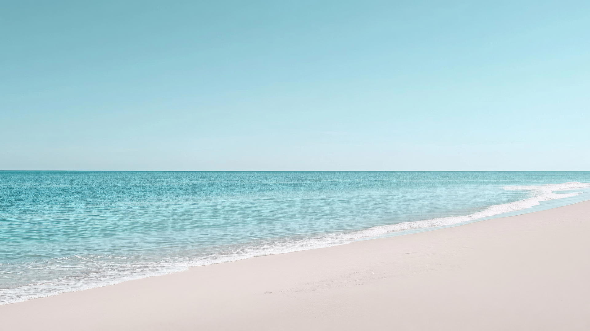 Beach background wallpaper with minimalist white sand and calm blue water under a pale blue sky.