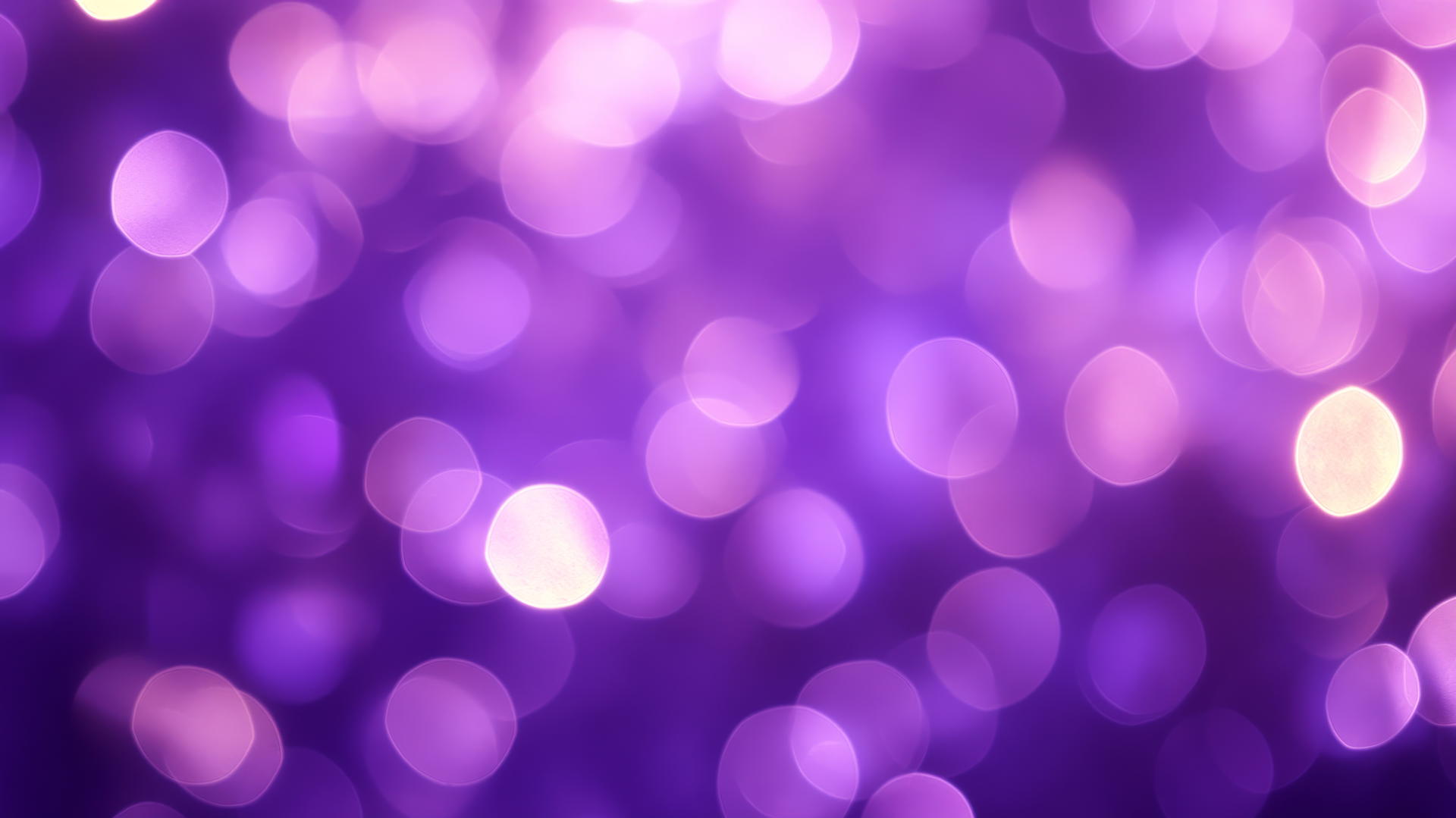 Purple background wallpaper with smooth bokeh effect and blurred lavender and violet circles of light