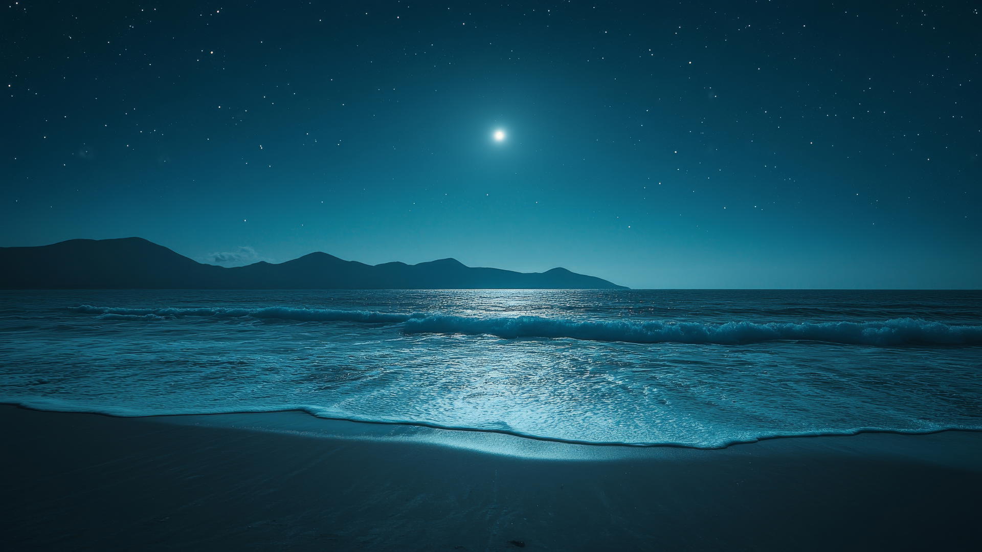 beach wallpaper with night sky, moonlight on ocean waves, and mountain silhouettes
