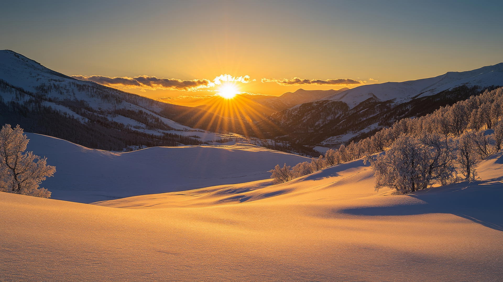 beautiful winter wallpaper snow-covered valley at sunrise with golden light