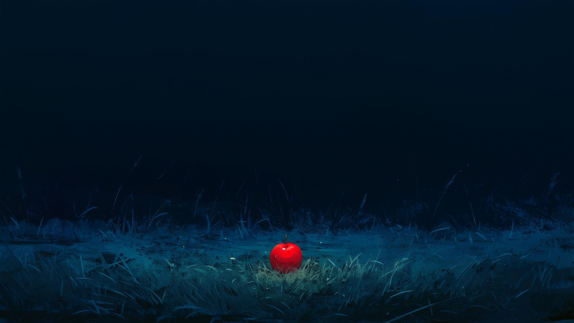 Bright red apple contrastingly lying alone on a dark aesthetic background