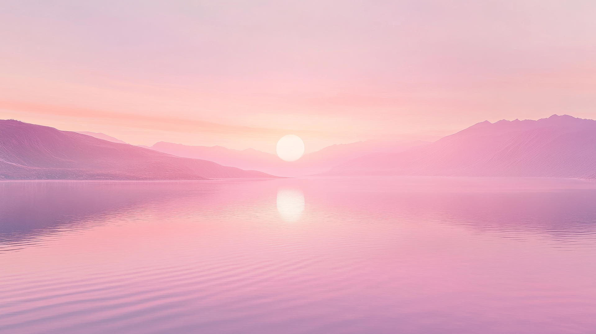 pink wallpaper aesthetic of a peaceful pink sunset reflected on a calm lake with mountains in the distance