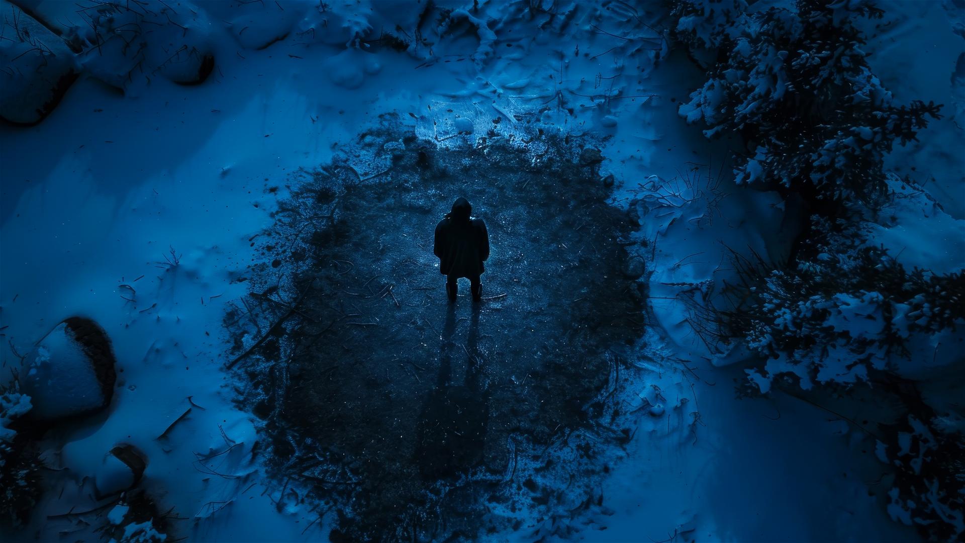 Aerial view of unknown part of Antarctica with a dark figure on the ground, portraying loneliness and stillness.