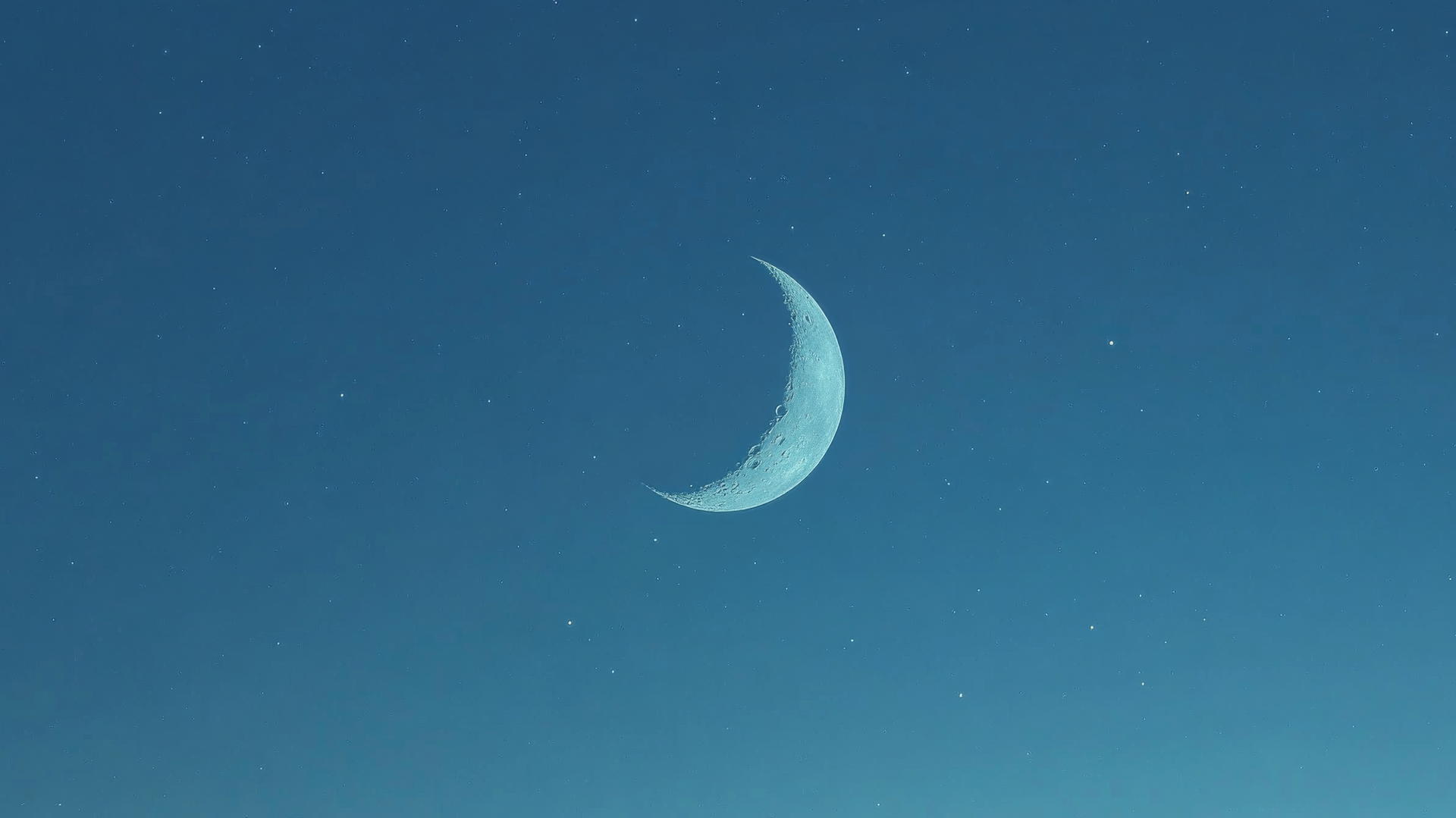 Minimalist blue aesthetic wallpaper with a crescent moon and stars