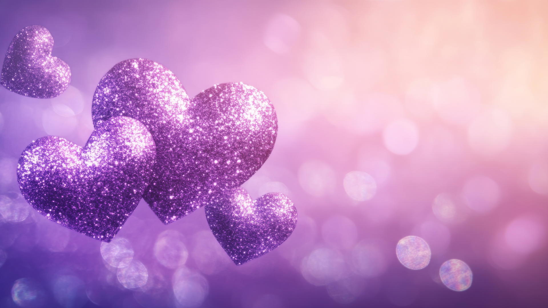Glittering purple heart wallpaper with sparkling hearts