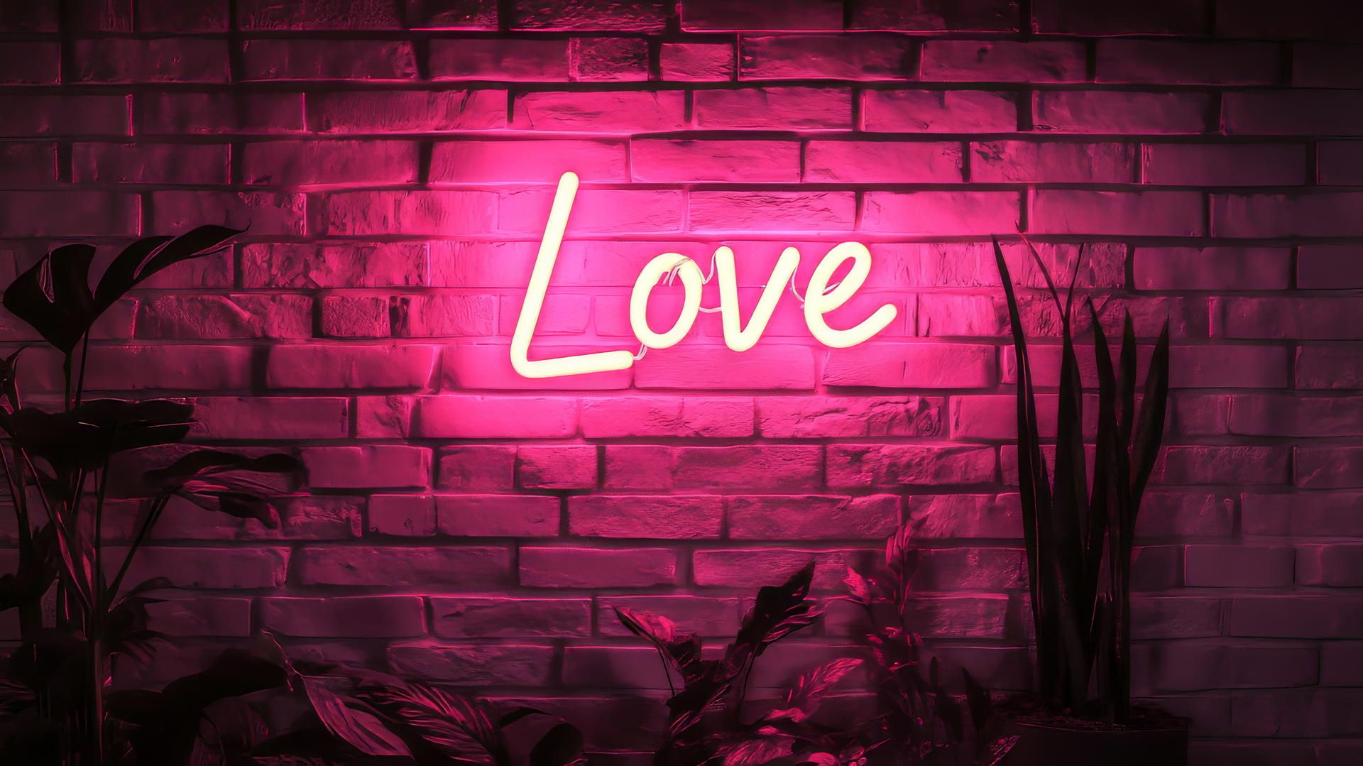 Pink aesthetic wallpaper with a neon 'Love' sign on a dark pink brick wall.