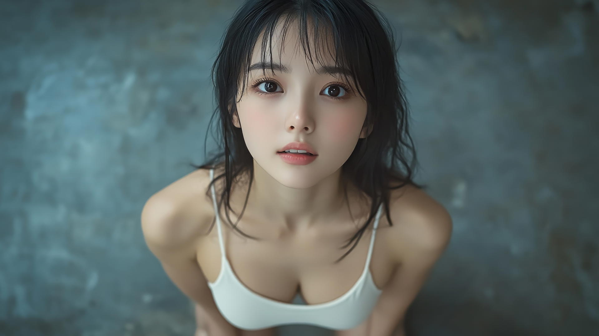 Asian girl kneeling, viewed from below, smiling with smooth pink skin and black socks