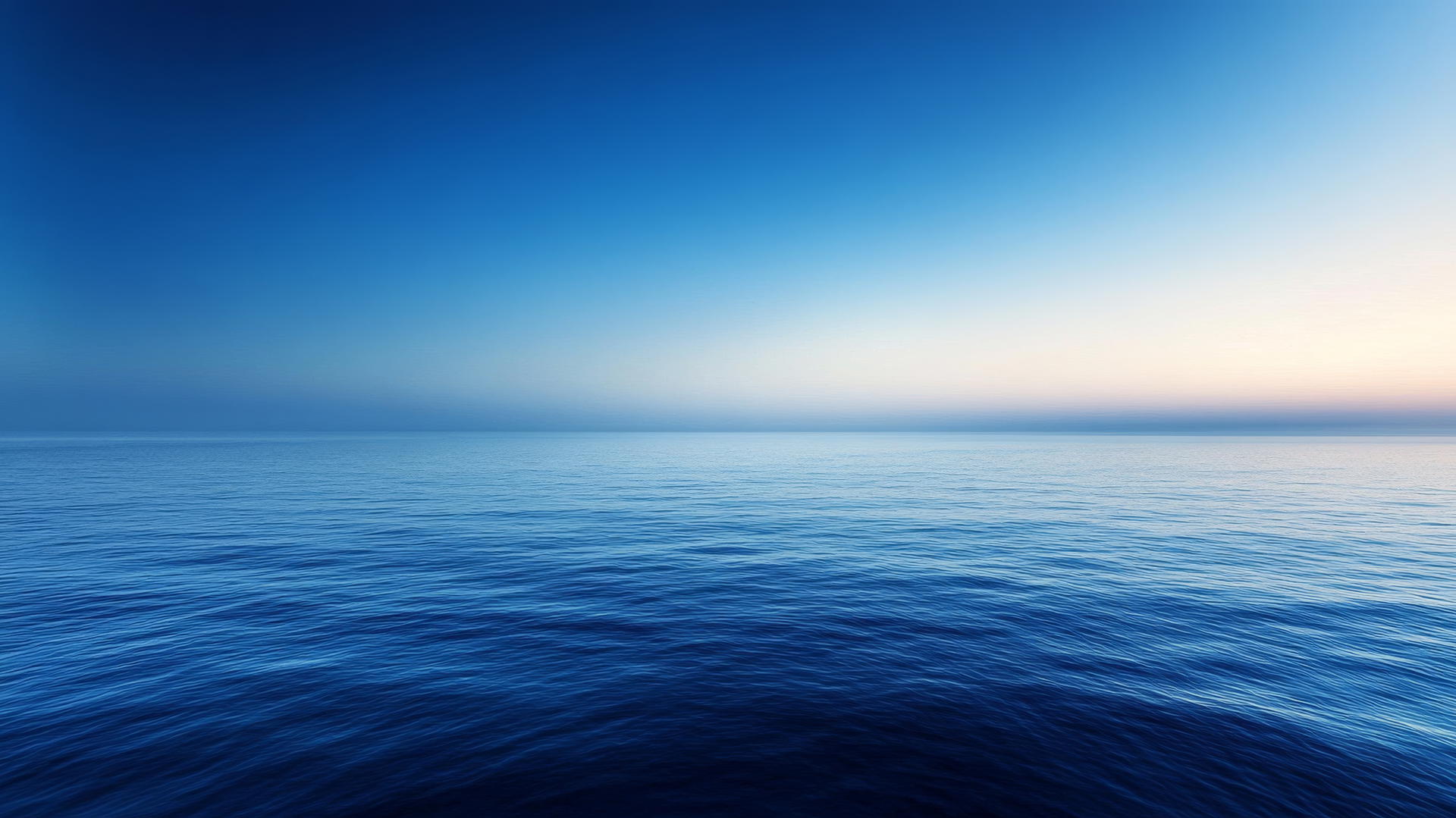blue background wallpaper with gradient resembling peaceful ocean horizon at dusk