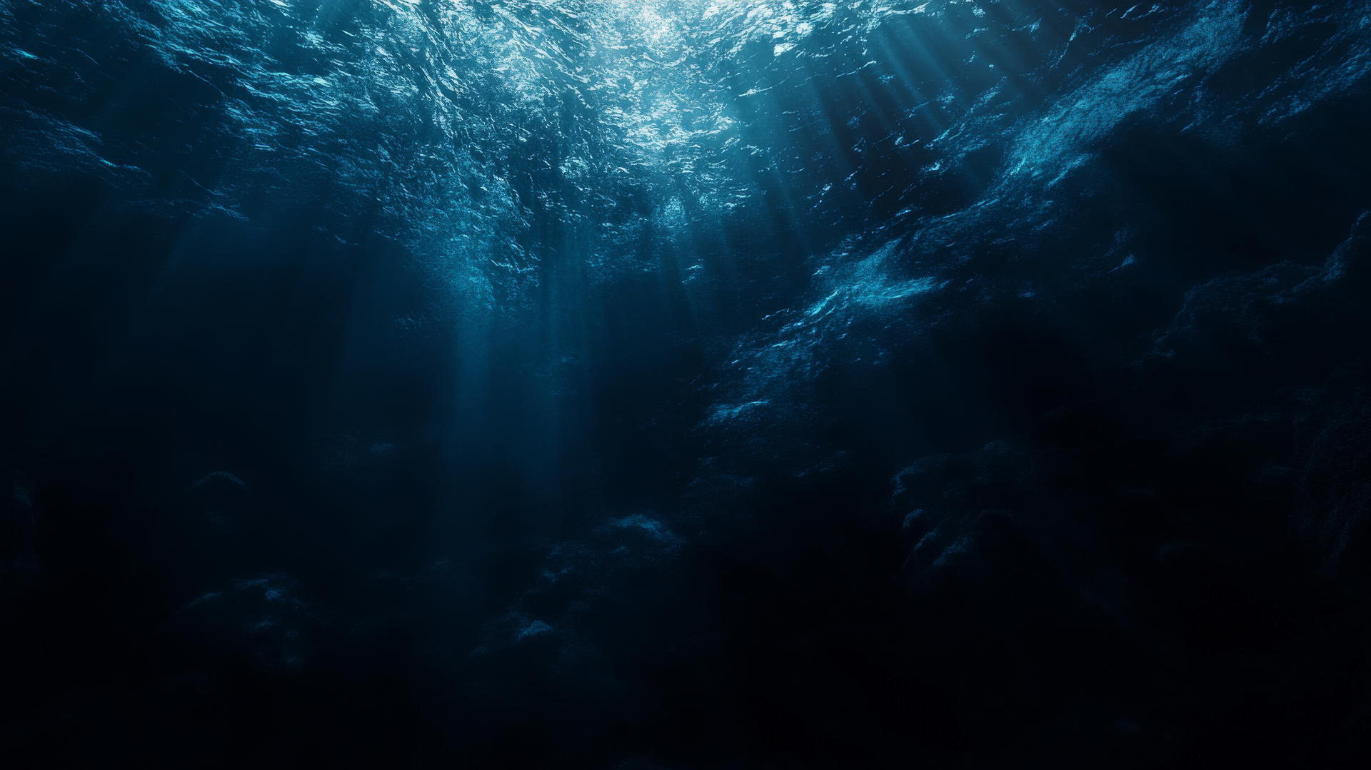 dark blue aesthetic wallpaper of deep ocean abyss with light rays