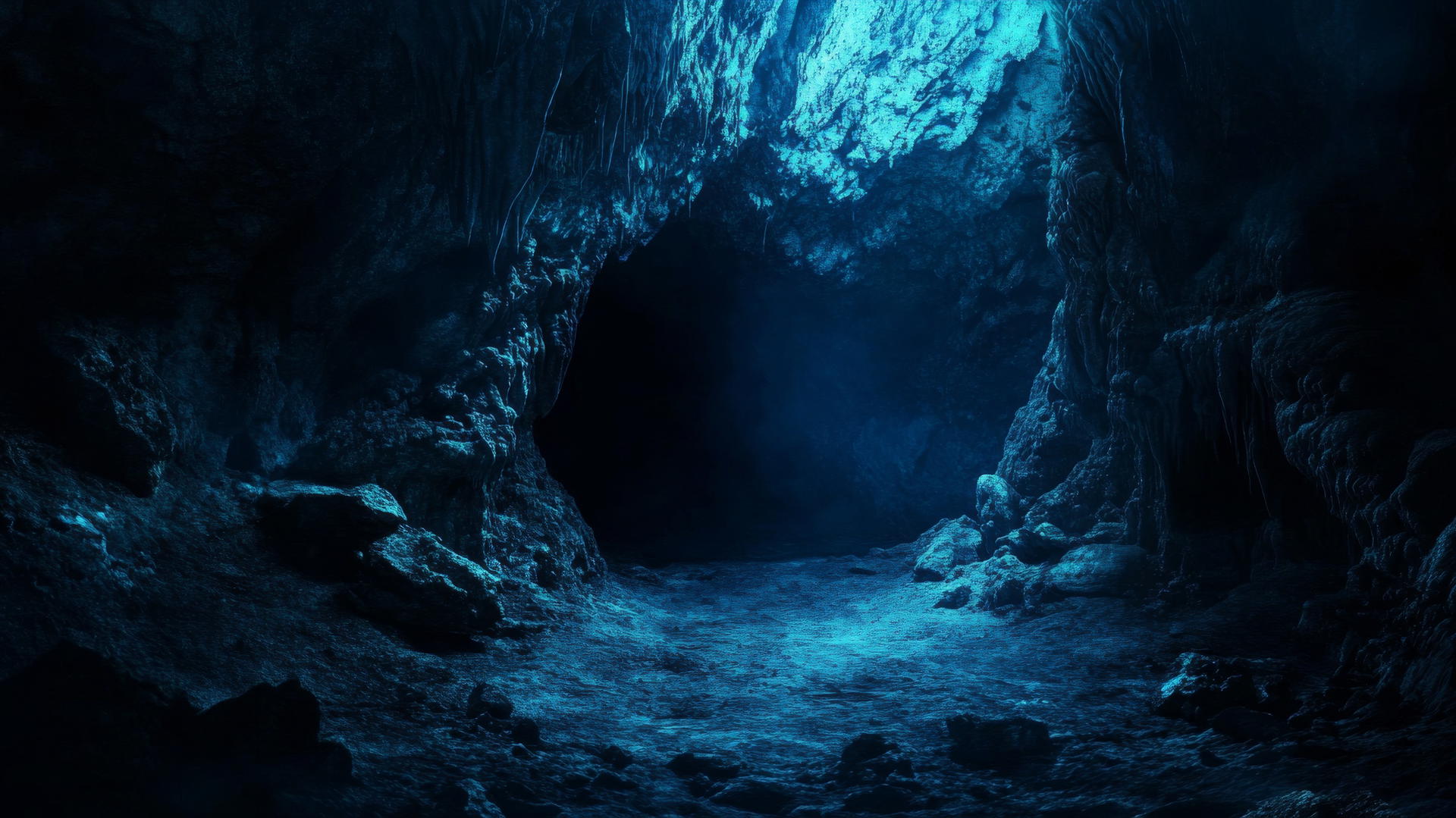 Dark blue wallpaper of a mysterious cave entrance with shadows and textures.