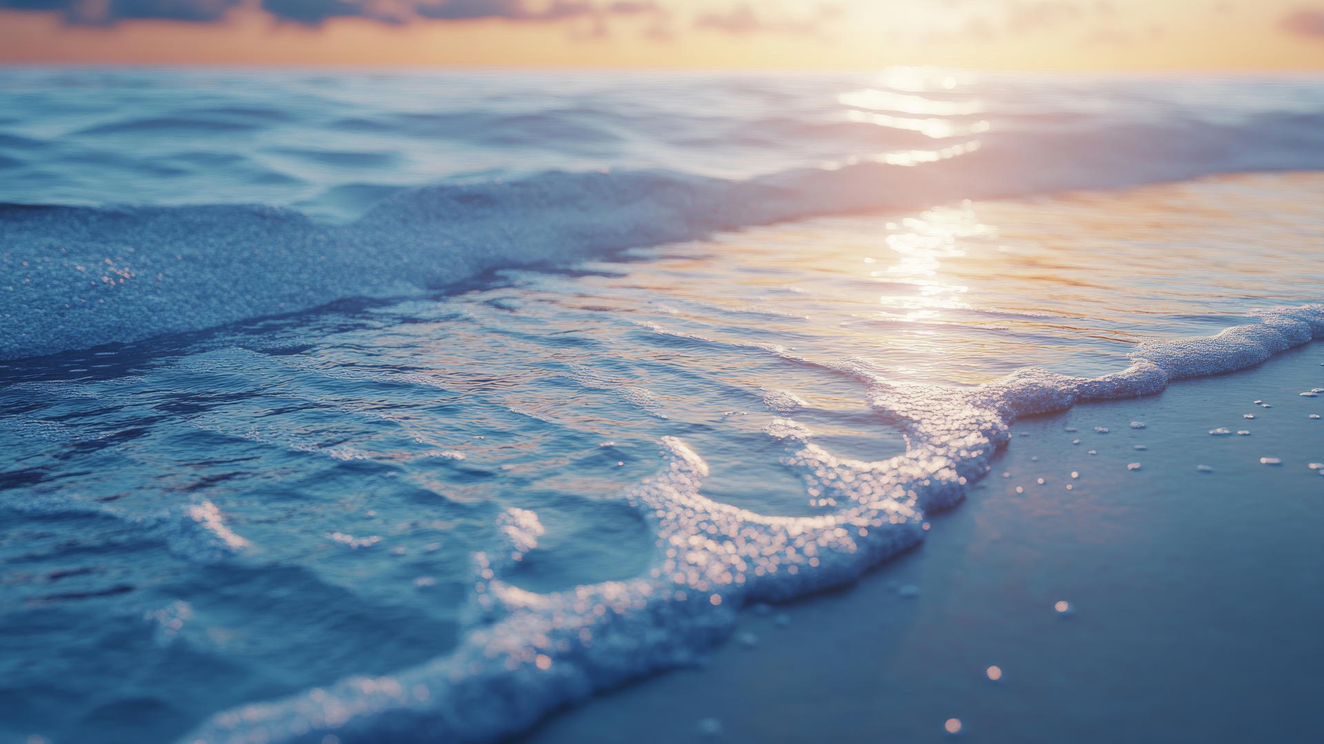 Serene beach wallpaper 4K at dawn with water ripples and textured sand