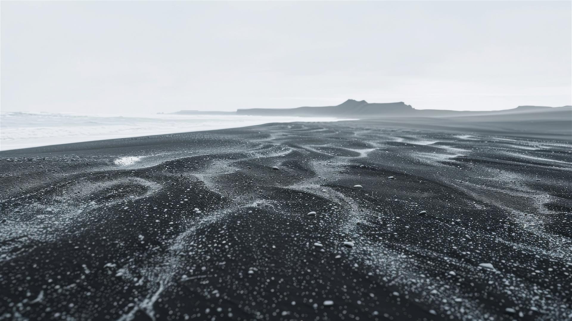 Black sand forming a minimalistic desert landscape
