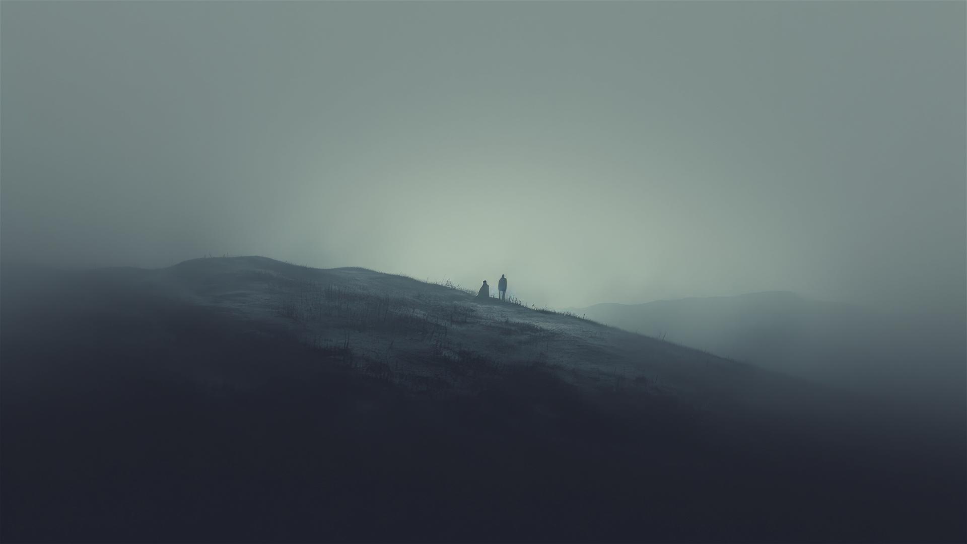 Monochrome view of aesthetic, fog-covered hills where horizon meets the sky