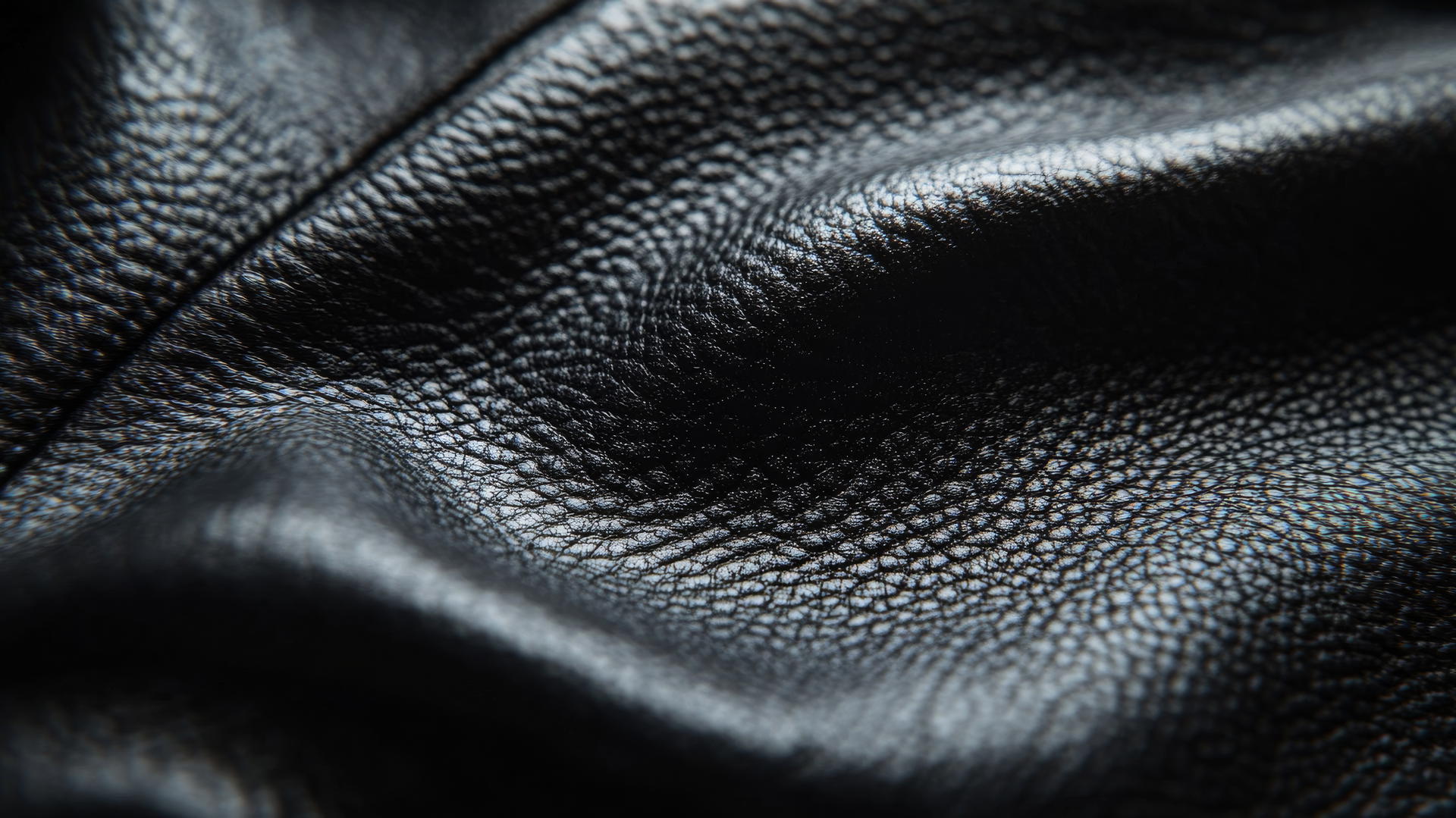 Black wallpaper aesthetic with detailed black leather texture and light reflections