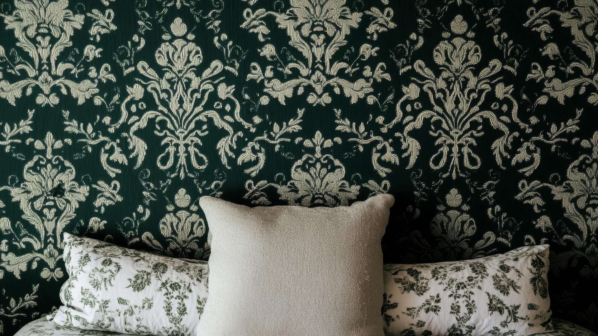 dark green wallpaper with vintage-inspired damask patterns
