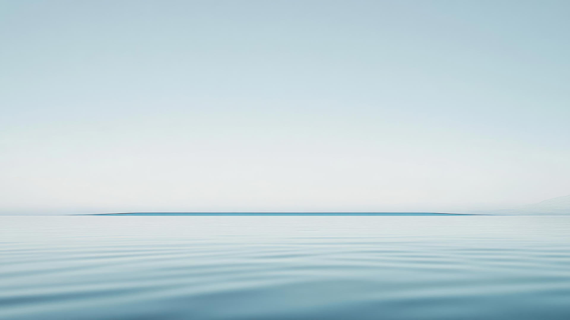 Aesthetic blue wallpaper with a minimalist single blue horizon line against a pale blue sky