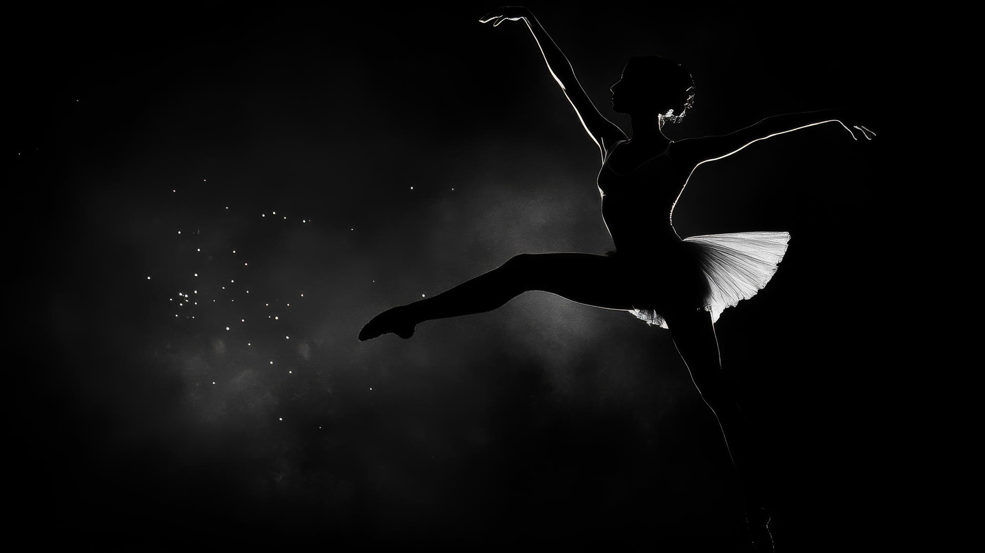 black and white wallpaper of a graceful ballerina mid-pirouette with an elegant silhouette
