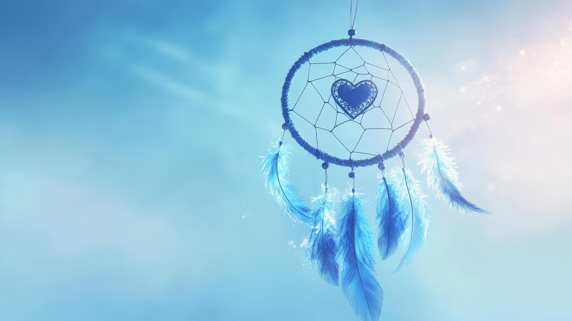 blue heart wallpaper with dreamcatcher and delicate feathers