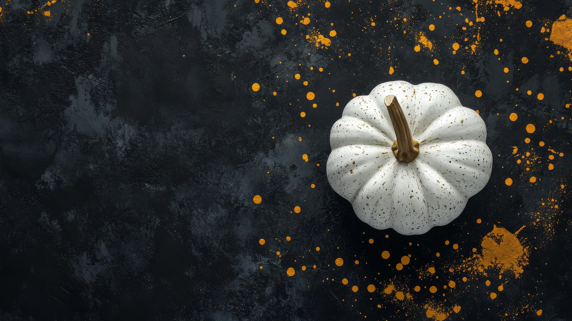 Aesthetic thanksgiving wallpaper with white pumpkin on dark slate background, gold splatters.