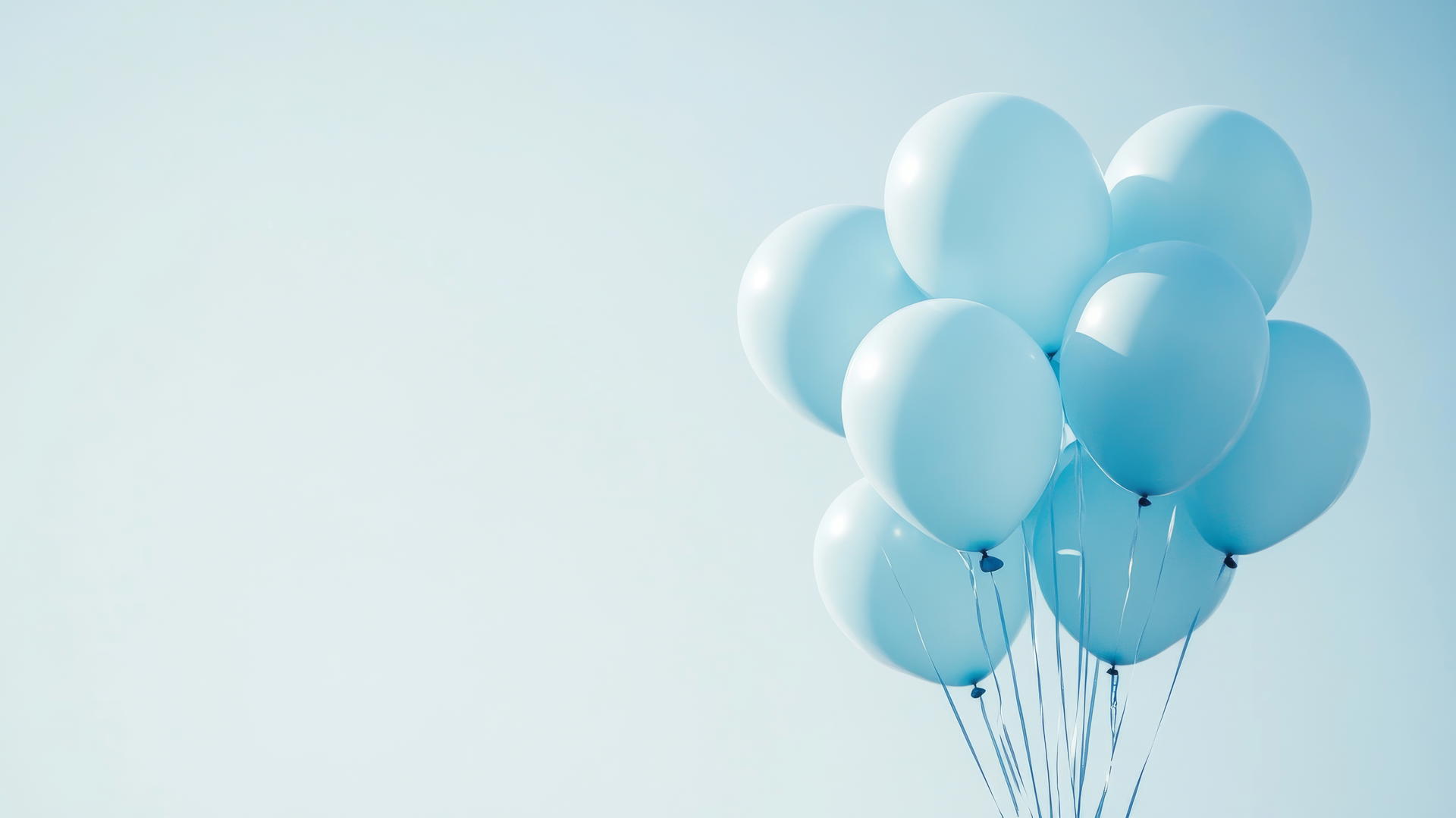 baby blue wallpaper with a bouquet of helium balloons against a light sky
