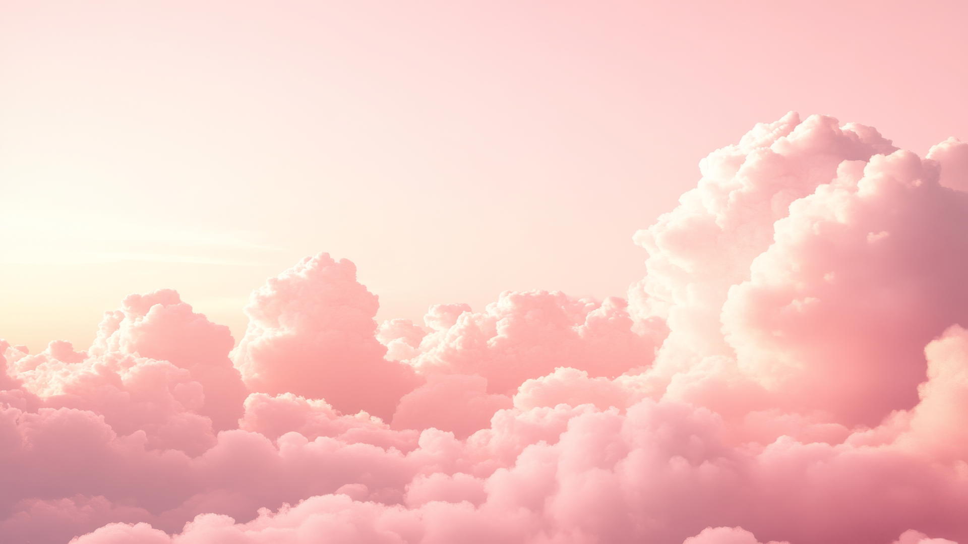 light pink wallpaper with dreamy, fluffy clouds in a gradient sky
