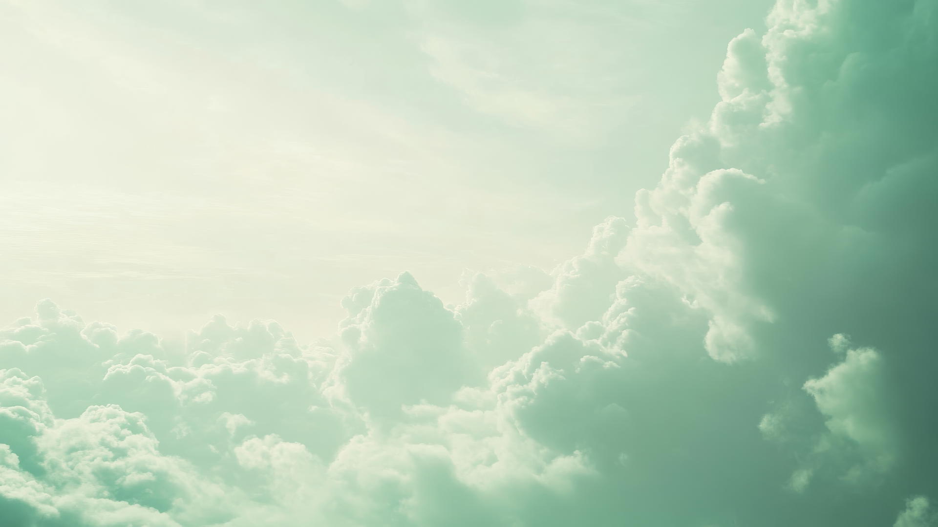 Sage green aesthetic wallpaper with soft green clouds and pale sky