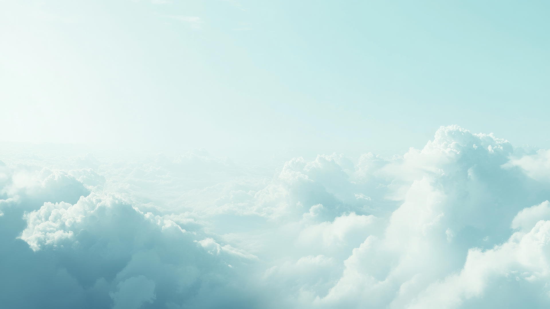 light blue wallpaper with soft pastel clouds floating in a clear sky