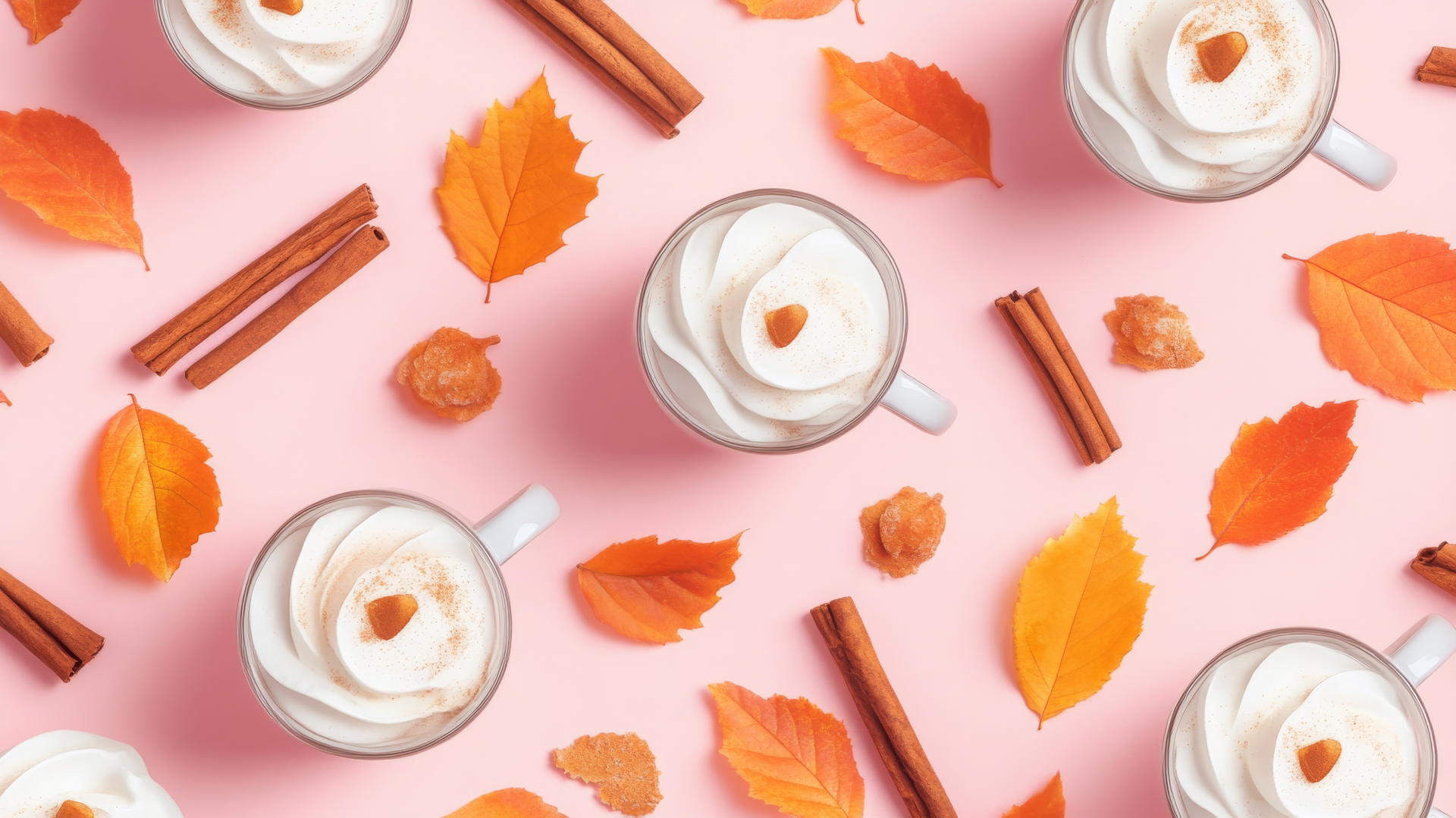 Preppy fall wallpaper with pumpkin spice lattes, cinnamon sticks, and fall leaves on pastel pink background